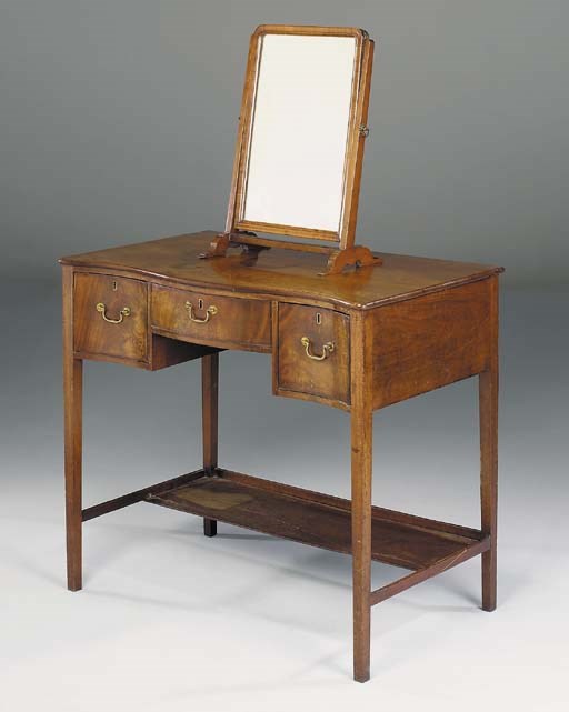 A George III mahogany serpentine dressing table