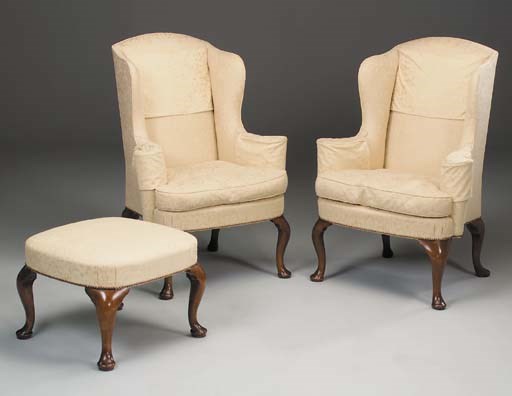 A pair of walnut wing armchairs, 20th century