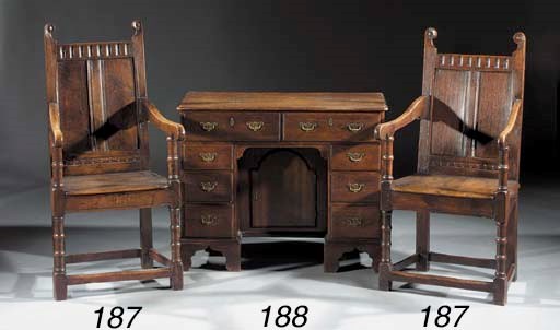 A pair of English oak armchairs