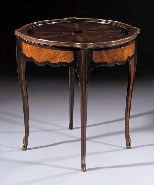 A French tulipwood, amaranth and parquetry centre table