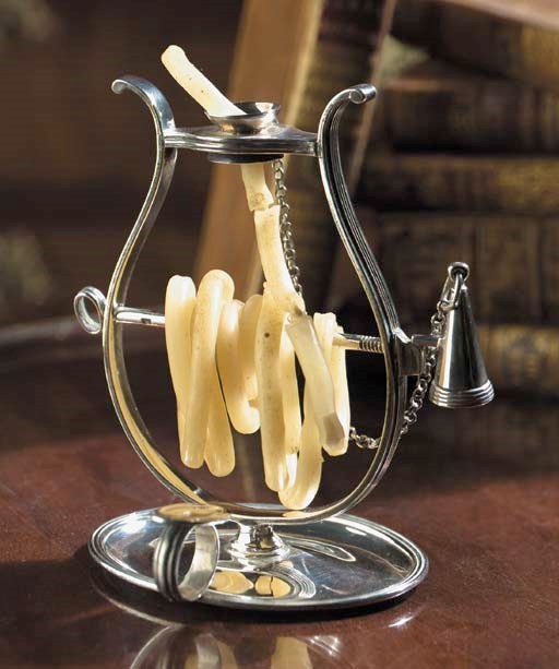 An English silver taper stand with wax taper