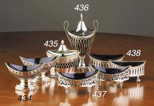 A pair of Dutch silver salt cellars with blue glass-liners