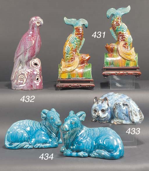 A pair of Chinese turquoise glazed models of recumbent goats
19th century