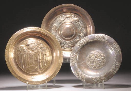 An Arts and Crafts copper wall plate