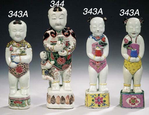 Three famille rose figures of the 'Laughing Twins'