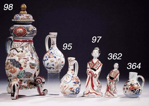 A blue and white and an Imari teapot and cover, a framed porcelain panel and an Imari figure of an actor