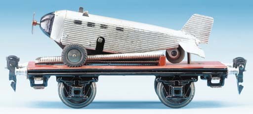 A  Märklin 17080 Flat Wagon with clockwork Passenger Airliner