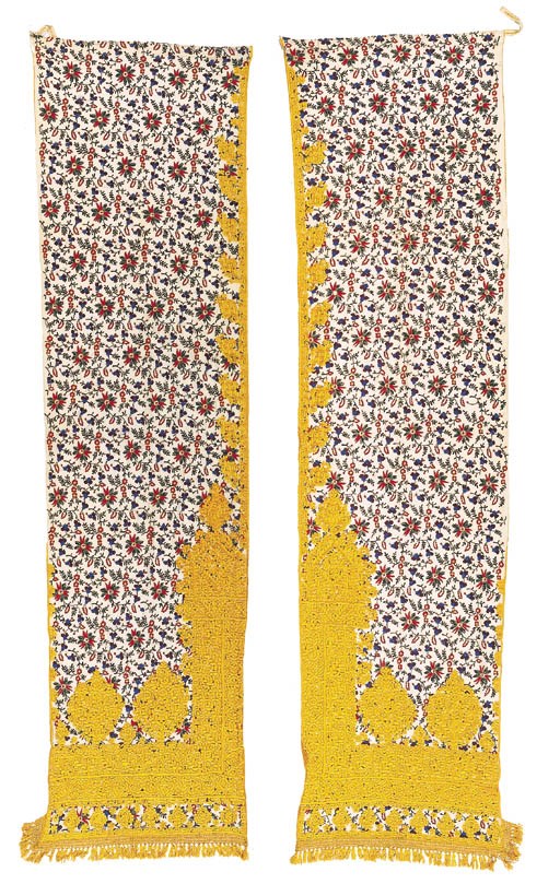 A pair of embroidered curtains,