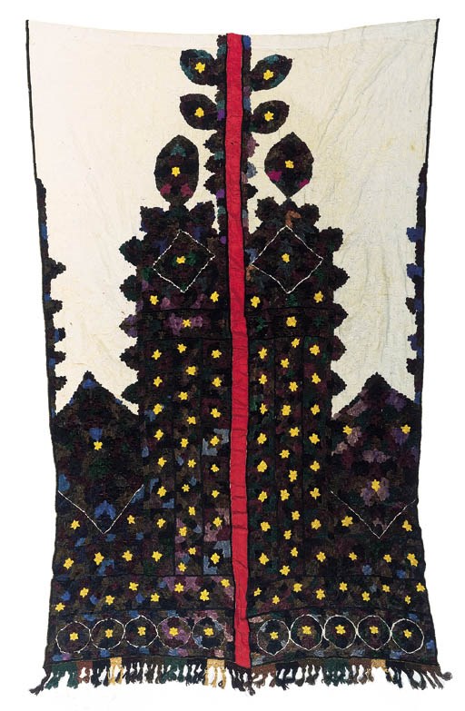 A pair of embroidered curtains, joined as a single panel,