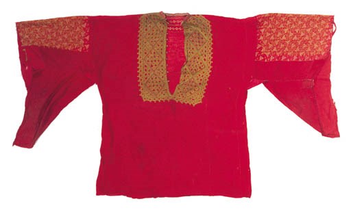 An embroidered dress of red muslin,
