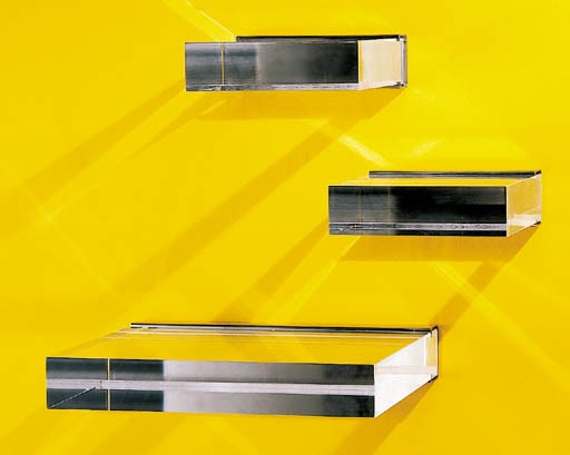 A GROUP OF THREE ACRYLIC AND STAINLESS STEEL WALL MOUNTING SHELVES