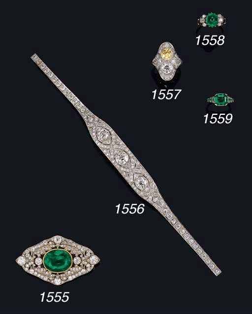 AN EMERALD AND DIAMOND BROOCH