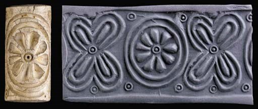 A SUMERIAN WHITE STEATITE CYLINDER SEAL