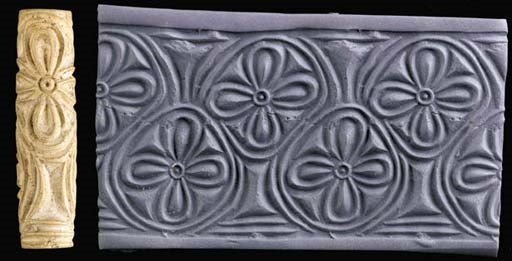 A SUMERIAN WHITE STEATITE CYLINDER SEAL