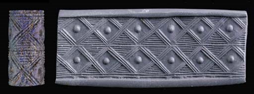 A SUMERIAN LAPIS LAZULI CYLINDER SEAL