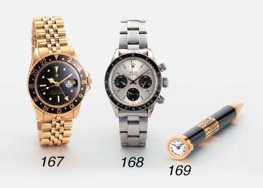 Cartier. A limited edition gilt and black lacquer ballpoint pen watch with calendar