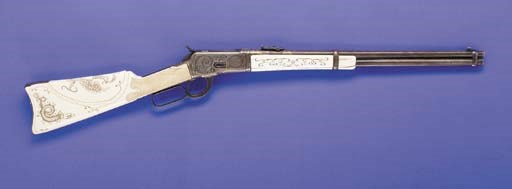 AN ENGRAVED GOLD AND SILVER INLAID .44 W.C.F. WINCHESTER MODEL 1892 SADDLE RING CARBINE, NO. 86783 FOR 1895