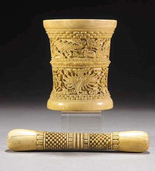 An ivory pestle and mortar
17th Century