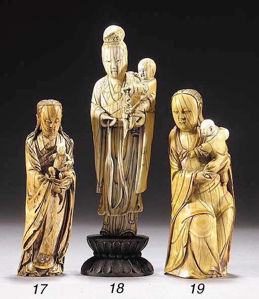 A Ming ivory model of a standing Guanyin and child
17th Century