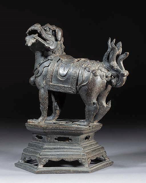 A bronze model of a lion
17th Century