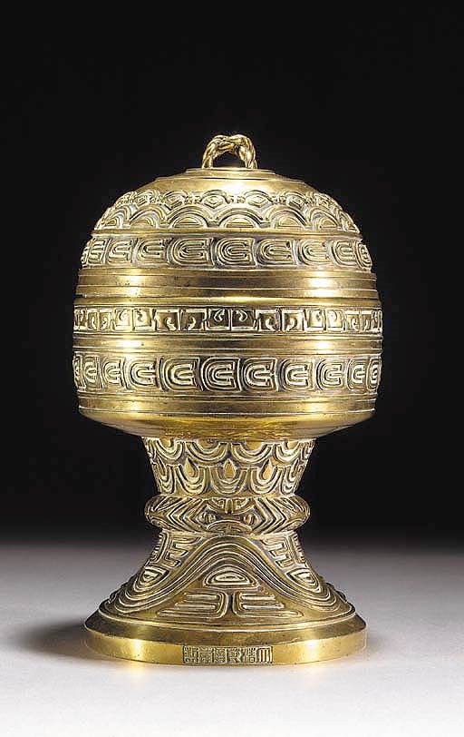 A bronze altar stem bowl and domed cover
Qianlong sealmarks and of the period