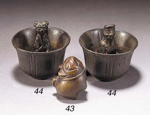 A bronze waterdropper modelled as a cat
18th/19th Century