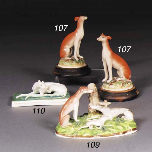 An English porcelain hound and hare spill vase