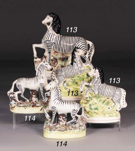 Two Staffordshire models of zebra