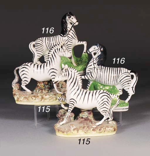 A pair of Staffordshire models of zebra