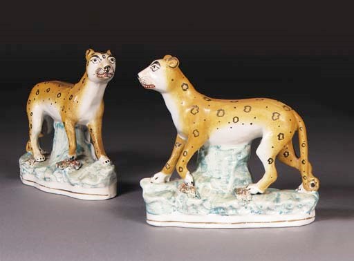 A pair of Staffordshire models of leopards