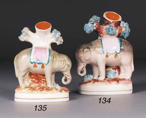 A Staffordshire elephant spill vase