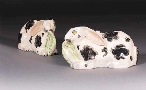 A pair of pottery models of rabbits