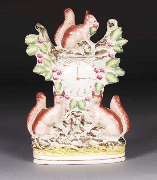 A Staffordshire clockface group