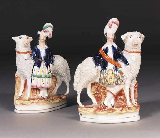 A pair of Staffordshire models of children and sheep