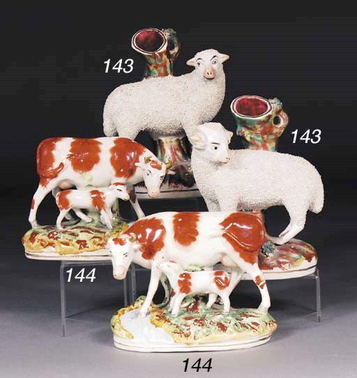 A pair of Staffordshire cow and calf groups