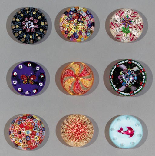 A collection of nine glass paperweights