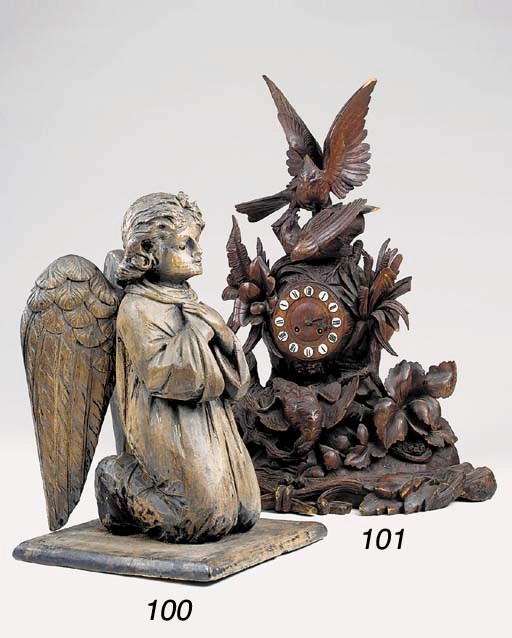 A carved wood figure of an angel, 20th century
