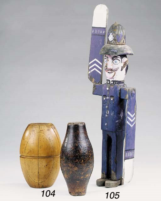 A carved and painted whirly-gig in the form of a policeman, 20th century