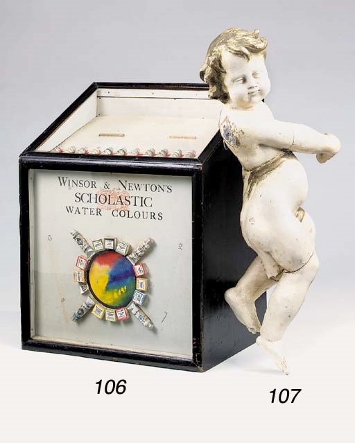 A polychrome painted carved wood figure of a cherub, possibly 18th century