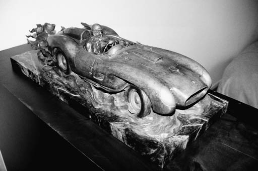 Clive Ellis  - Ferrari - A bronze depicting the famous Allen Connell 1958 Ferrari Pontoon Fender 335 Sport, chassis No. 0764 at speed with driver; signed and dated by the artist, No. 3 of 35 - 27.5 x 11in.