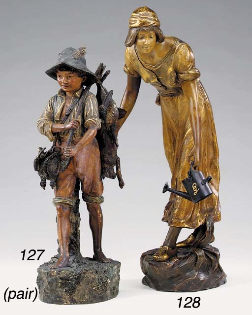 A pair of Austrian polychrome terracotta figures, late 19th or early 20th century