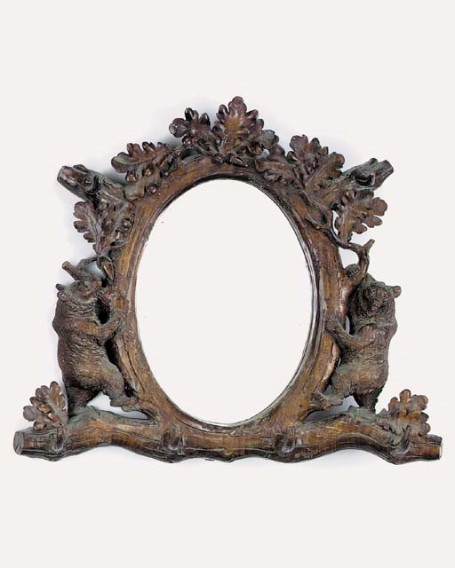 A Black Forest carved and stained pine hall mirror, late 19th or early 20th century