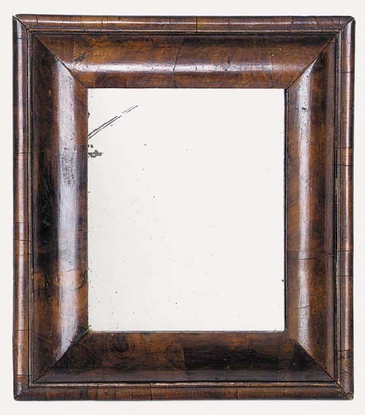 A Queen Anne Walnut cushion framed wall mirror, first quarter 18th century