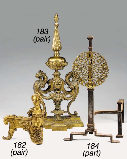 A pair of steel and brass mounted andirons in the 17th century style