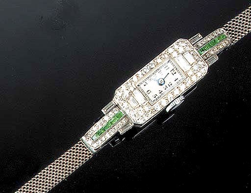 A lady's Art Deco diamond and emerald wristwatch,