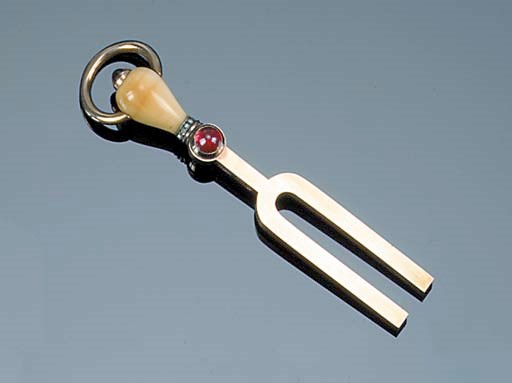 An early 20th century Eastern European gold novelty pendant,