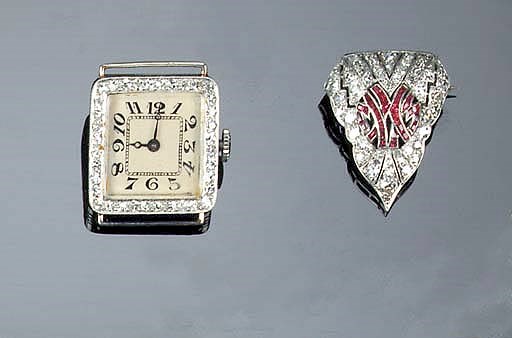 A lady's diamond watch and a diamond and gem brooch,