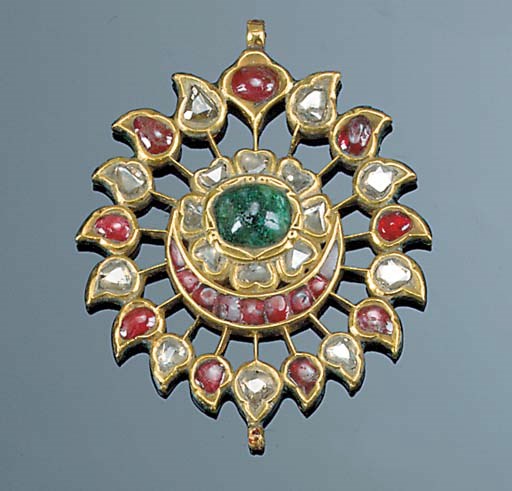 An Indian lasque-cut diamond, foiled ruby, gem and enamel pendant