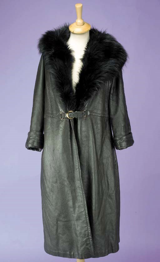 A chocolate brown leather coat, with deep black fur collar and lined in black plush, labelled A BONNIE CASHIN DESIGN SILLS AND CO, circa 1960