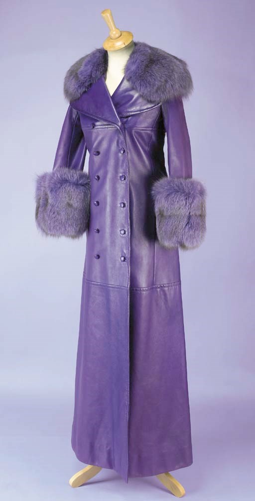 A full length purple leather coat, with deep purple fur collar and cuffs and quilted lining, labelled CHRISTIAN DIOR PARIS Automne-Hiver 1971 and stamped 155951